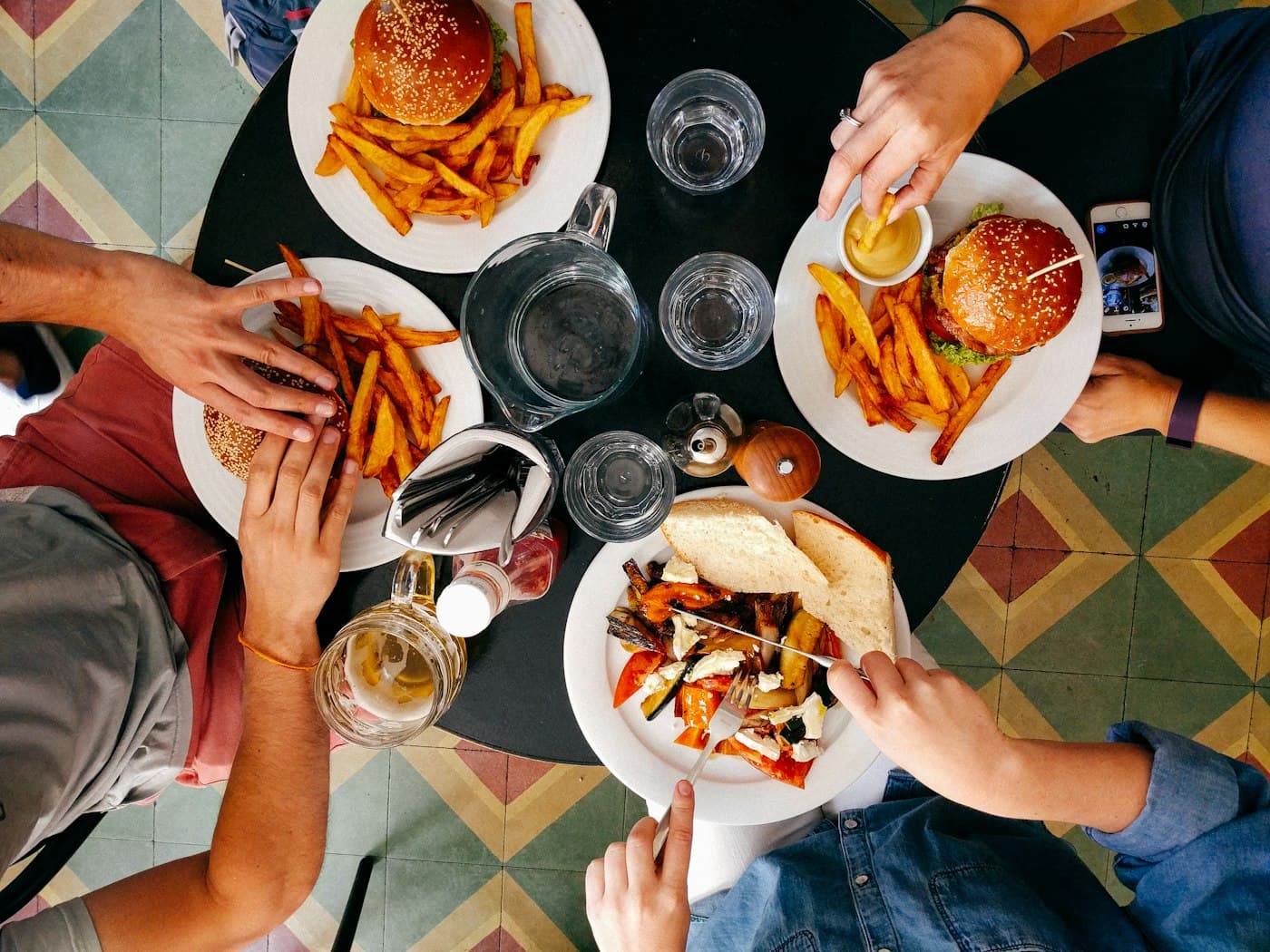 Friends gathered around a spread of barbecue